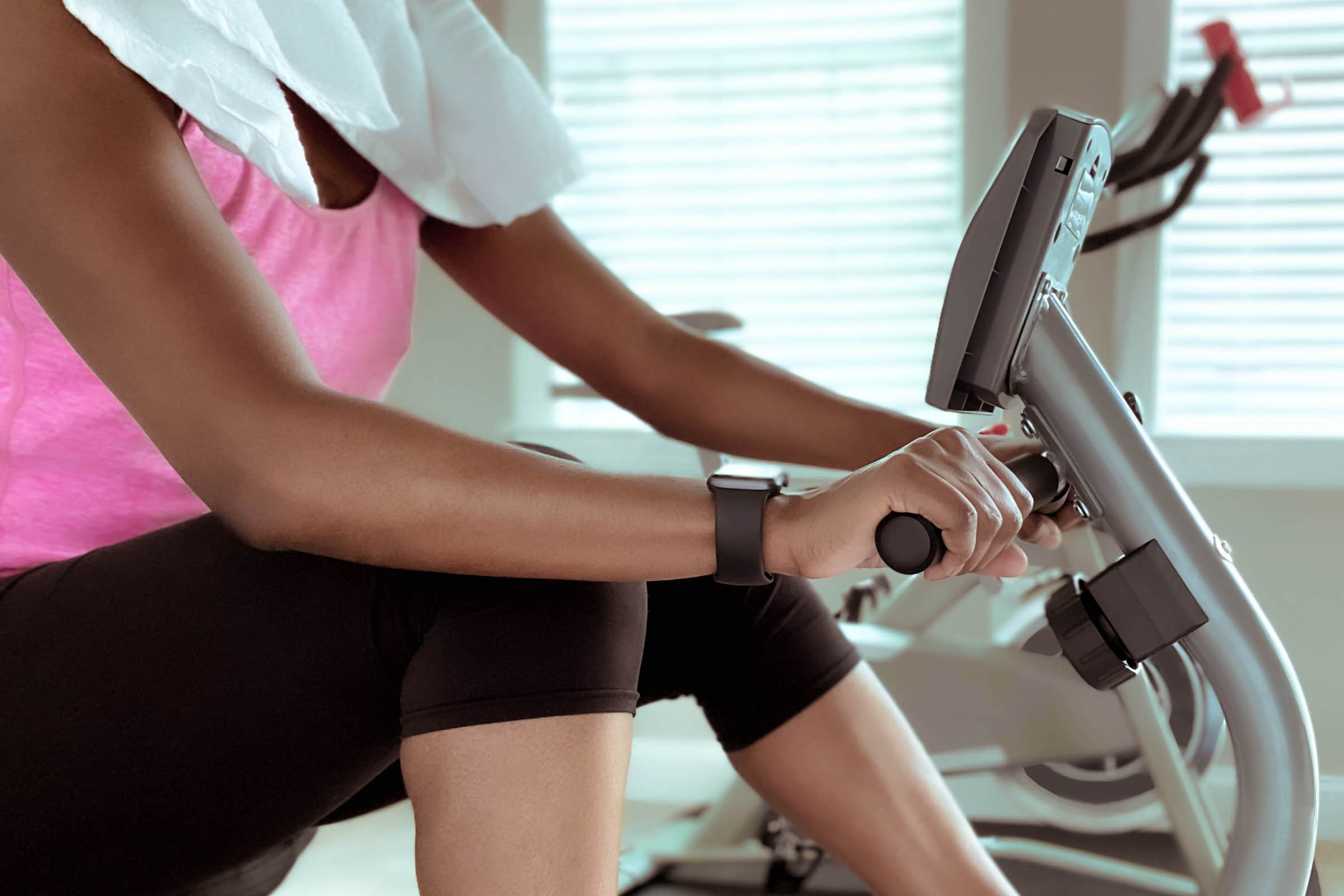Woman Exercises on Recumbent Bike